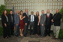 Rep. Raja Krishnamoorthi (D-IL 8th), fifth from right, with l. to r., guest Debbie Cooper; Kirk Cooper, L-60; IR Miguel Fonseca; guest Lisette Fonseca, IVP-GL Larry McManamon; guest Julie Tortat; John Tortat, L-60; AD-ISO Bill Staggs; and ED-QCCUS/AD-CSO Eugene Forkin III. 