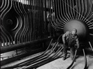 A boilermaker inspecting feeder tubes in a water wall