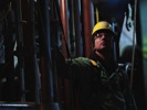 A Boilermaker spotting a tube wall as it is maneuvered into place, Prairie State Energy Campus, Illinois, 2010