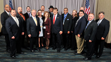 REP. DUTCH RUPPERSBERGER (D-MD-2nd), center, red tie, with IP Newton Jones, fifth from left, IVP D. David Haggerty, far right; IR Marty Stanton, 7th from left (back); guests; and delegates from L-193 and L-S50.