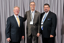 REP. JARED HUFFMAN (D-CA-2nd), center, with l. to r., IP Newton Jones and IVP J. Tom Baca.