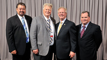 RON AULT, President, Metal Trades, second from left, with, l. to r., IVP J. Tom Baca, IP Newton Jones, and IVP Warren Fairley.