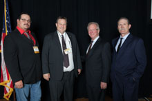 Sen. Jon Tester (D-MT), second from left, with (l. to r.) Jason Small, L-11; IP Newton Jones; and Tim Laedeke, L-11.