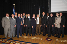 REP. SANDER LEVIN (D-MI 9th), center in brown suit, with IP Newton Jones to Levin’s right; IVP Larry McManamon third from left; SAIP-CSO/D-NCA Tony Jacobs, seventh from left; IST Bill Creeden, eighth from left; and members of the Michigan delegation.