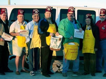 Shriners raising funds for children’s hospitals include Local 27 member Jeff Casson (third from right) and his father and brother, L-27 retirees David Sr. (ctr.) and David Jr. (r.)