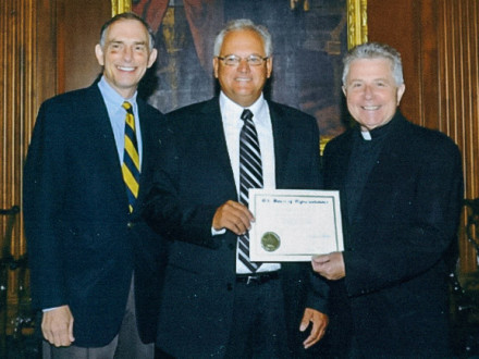 Bruce Scott, center, receives a certificate commemorating his prayer from Rep. Visclosky left, and Rev. Daniel P. Coughlin, Chaplain of the House of Representatives, right.