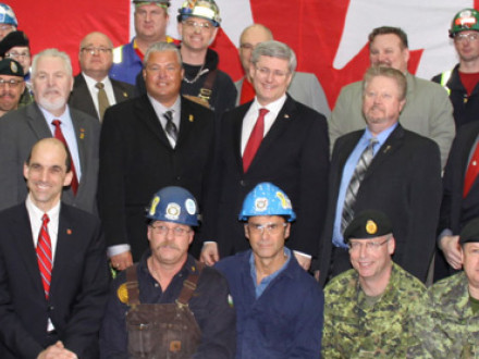 Canadian Prime Minister Stephen Harper (center with glasses and red tie), joins 