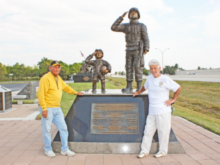  L-237 retiree Rudy Diaz, right, and partner Danny Pardo stand before the statue they created for display in Cape Coral, Fla.
