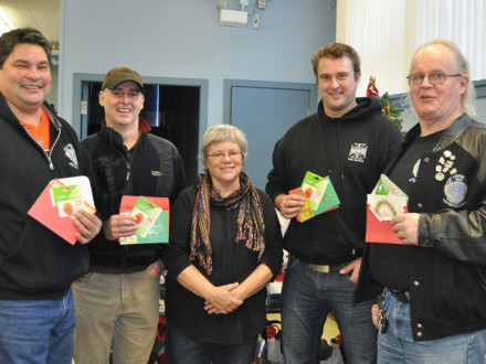 L-359 members present gift cards to Patti Larson, representing the Christmas hamper in Revelstoke, British Columbia. Left to right, J’onn Giese, Rick McIssac, Larson, Adam Saunders, and Jim Wymer.