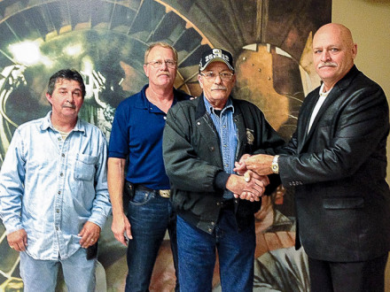 L-37 (NEW ORLEANS) MEMBER GARY WEILAND, third from left, receives his 40-year pin from David L.Hegeman, District Manager of District 5. Also pictured are, far left, Perry Picou, L-37 president, and, second from left, Lionel Hanna, L-37 BM-ST.