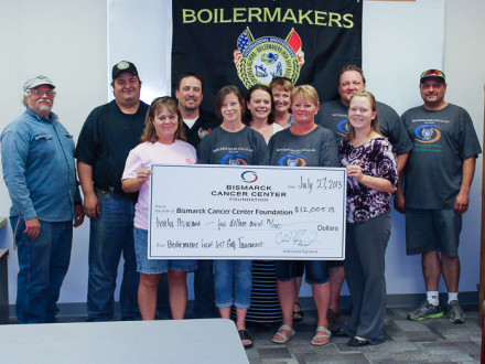 Left to right, front row: Patti Olander, wife of member Arlyn Olander; Billie Jo Sailer, wife of member Troy Sailer; Audra Beckler, sister of member Arlyn Olander; and Sarah Klein, BCCF. Back row: Bob McKay; Chad Bergstad, golf committee chairman; Assistant Business Manager Wendlin Piatz; Tara Schilke, BCCF; Deb Colton, BCCF; Boe Gilbert; and Dana Seil.