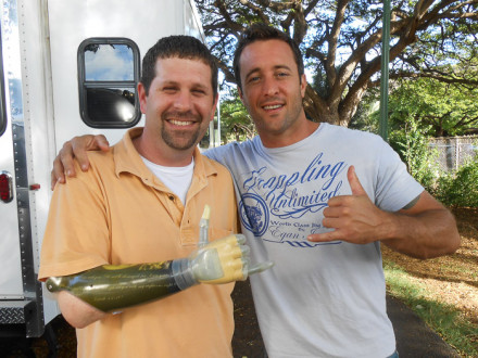 Jason Koger, left, and Alex O’Loughlin, star of the new Hawaii Five-O series as Steve McGarrett, flash a shaka hand sign, a Hawaiian symbol for “hang loose” or “Aloha.” Koger’s bionic hands have movable fingers.