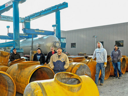 L-84 officers and stewards stand among slug catcher manifold sections in the loading yard. L. to r., Brent Mitzner, president; Philip Slater, steward; Doug Damron, secretary-treasurer; Bob Wheeler, recording secretary; Nathan Eichorn, steward; and Jeremy Wright, steward. Not pictured are Brian Haight, vice president, and Josh Dilliner, inspector.