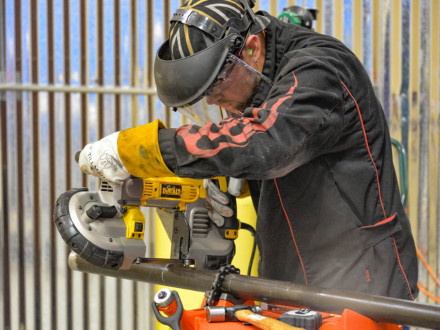 Arthur Kling, L-13, cuts out a short piece of replacement tube, called a “pup,” during the waterwall exercise in 2014 at the Boilermaker National Apprenticeship competition, where he captured top honors. With the Biden Administration ending IRAPs, union apprenticeship programs such as BNAP remain the gold standard in training. 
