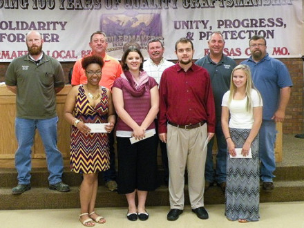 L-83 (KANSAS CITY) SCHOLARSHIP WINNERS are pictured with the lodge's scholarship committee. Front row, l. to r., Taylor Ashley, daughter of Todd Ashley; Miranda Helmich, daughter of Bill Helmich; Bruce Smith, Jr., son of Bruce Smith; Tristin Reed , daughter of Sam Reed; back row, l. to r., Scot Albertson, Business Agent; Joe Lewandowski, BM-ST; John Seward, Shop Representative; Scott Campbell, President/ Business Agent; and Tom Dye, Vice President /Business Agent. Not pictured: Danielle Phipps, daughter of 