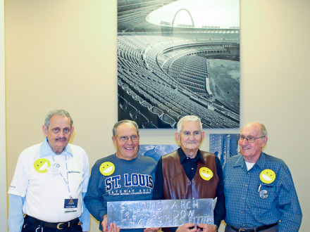 Former Boilermakers who helped build the Gateway Arch stand with a remnant of the actual stainless steel used in fabricating the monument sections. The men were on hand to celebrate Arch Builders Day in St. Louis Oct. 28.  Left to right, Ken Wright, Donald Chambers, Ike Erdman and Archie Brittain.  Walt Atwood photo
