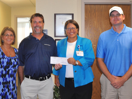 Local 105 Boilermakers present a check to the Southern Ohio Medical Center Hospice. From left: Sheila Riggs, Southern Ohio Medical Center Hospice; Scott Hammond, BM-ST, Local 105 (Piketon, Ohio); Teresa Ruby, SOMC Hospice; and Joe Ledford, chairman of the golf committee for L-105.