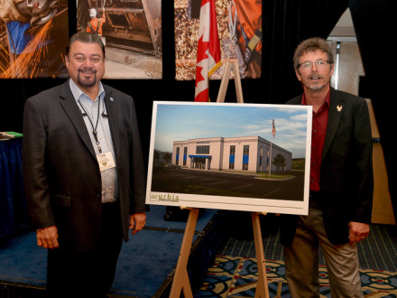 IVP-WS J. Tom Baca, left and IR James Cooksey show a rendering of the Salt Lake City training center.