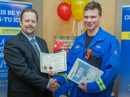 Michael Barnett, Director of New Brunswick Apprenticeship and Occupation Certification, left, awards L-73’s Sheldon Patterson with his Red Seal Certificate.