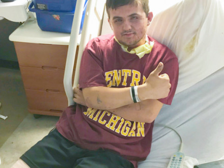 Local 169 apprentice Patrick Morand gives a thumbs-up after being hospitalized.