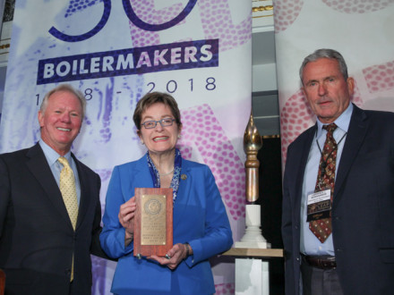Rep. Marcy Kaptur accepts the Boilermakers’ top legislator award for a member of the U.S. House. L. to r., IP Newton Jones, Rep. Kaptur and IVP-GL Larry McManamon.