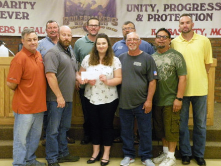 Pictured at left back row, l. to r.: Inspector John Seward, Recording Secretary Zach Hayes, and Iowa Rep Tom Dye. Front row, l. to r.: President Robbie Gant, BM-ST Scot Albertson, scholarship recipient Samantha Hicks, Kenneth Hicks, Trustee Dave Delgado and Trustee Danny Eastwood.