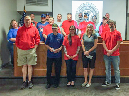 Members of Local 158 wear red to raise funds for Honor Flights. They donated $2,100 to Honor Flights at their May meeting. 