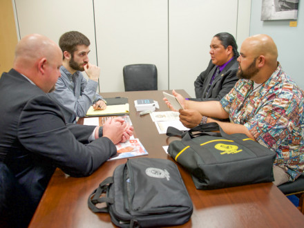 Local 627’s Shane “Kalai” Ferreira, who works for BAE Systems in Hawaii, offers reasons why a strong Jones Act is essential to the nation. L to r: BM-ST Jacob Evenson; Jesse Isleman, legislative aide of Sen. Brian Schatz (D-HI); Wesley Dale and Ferreira.