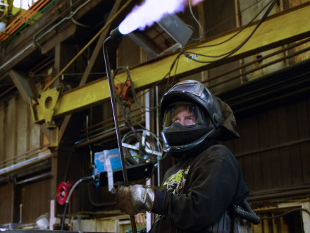 Mark Felger, L-104, fires up a rosebud torch to make the 'Cadillac of winches' at Markey Machinery in Seattle.