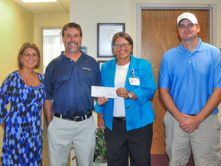 Local 105 Boilermakers present a check to the Southern Ohio Medical Center Hospice in 2016, as they do every year after their charity golf scramble. From left: Sheila Riggs, Southern Ohio Medical Center Hospice; Scott Hammond, BM-ST, Local 105 (Piketon, Ohio); Teresa Ruby, SOMC Hospice; and Joe Ledford, chairman of the golf committee for L-105.