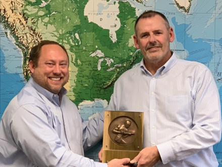D-NRS-CSO Tim Simmons, left, presents a retirement gift from the Boilermakers to Dave Douin, Boilermaker and outgoing executive director of the National Board of Boiler and Pressure Vessel Inspectors.
