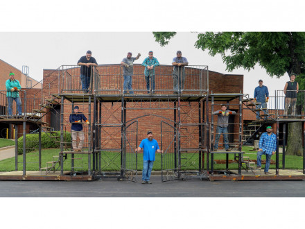 Local 83 apprentices build a set for the Theater in the Park production of “Newsies.” Those working on the set are: bottom levels from l. to r., William Wilson, Apprenticeship Coordinator Tom Burgess, Tuilama Anani and Dominic Webel. Top levels from l. to r., Cristina Redbear, Andrew Record, Josh Jolliff, Steve Brown, Josh Jiles, Johnathon Rearrick and Saige with Theater in the Park. Not pictured: Kody Uhlich and Faigame Tupai.