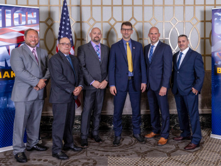 Delegates from the Great Lakes welcome Frank Mrvan, D-IN 1st, during the Boilermaker reception. From l. to r., ED-CSO Tim Simmons, IVP-NE John Fultz, IR Steve Adair, Mrvan, IR Daniel McWhirter and IR Ryan Mroz.