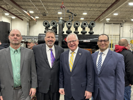 L. to r., L-647 recording secretary Scott Hollerud, Joel Johnson of OneMinnesota Government Affairs, Minnesota Governor Tim Walz and National Coordinator of State Legislative Affairs-M.O.R.E. WIF, Martin Williams, celebrate after HF 10 is signed into law.