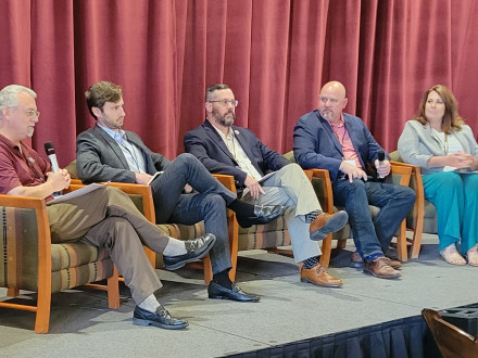 L-627 BM-ST Jacob Evenson, second from right, talks about the importance of local workforce engagement to help developers and contractors succeed in large-scale infrastructure work bids.