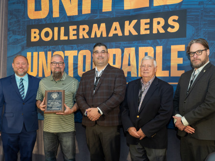 L-374 accepts NACBE’s top safety award, the John R. Erickson award. L. to r. IP Timothy Simmons, L-374 BM-ST Brad Sievers, IVP-GL Dan Sulivan, NACBE Executive Director Ron Traxler and IST Clint Penny.
