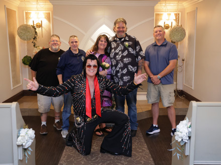 Christy and Mike Tiemann honor their promise to one another only to wed if it took place in Vegas, officiated by Elvis. The wedding party included, l. to r. (with Elvis in front) Great Lakes Area organizer Bryan Cato, IR-ISO Ryan Mroz, Christy and Mike Tiemann and Great Lakes recruiter/organizer Kevin Stewart. 