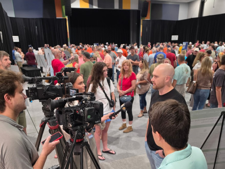 L-454 BM/ST Lee Lunsford speaks with local news stations