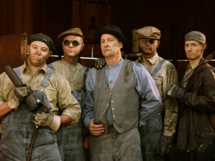 Boilermakers pose during re-enactment of a riveting scene for a new film. L. to r., Jack Dufur, Local 101; Nick Demaria, Local 83; John Standish, lead instructor with the Boilermakers National Apprenticeship Program; Joseph Fross, Local 101; and Brent Hendrix, Local 101. All but Standish are fourth-year apprentices.