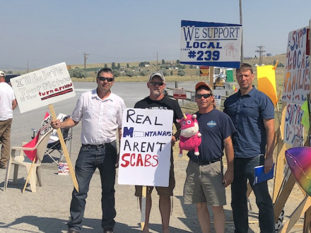 Members of Local D239 in Three Forks, Montana, man the picket line outside the Imerys Talc facility that locked them out August 2. Lodge president Randy Tocci holds a toy unicorn, referencing Montana Governor Steve Bullock’s assertion to the media that the lockout is a “unicorn” in Montana — a rare occurrence. The last lockout in the state happened in the 1980s.