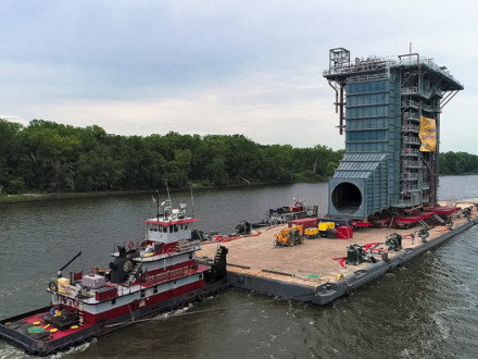Towed, pushed and guided by three tugs, the 4,000-ton HRSG heads down the Hudson River August 7.  Photo courtesy of Drone Pilots Leon Taufield & James Griggs Sr.