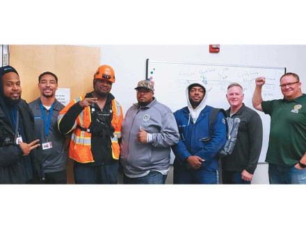 Doppelmayr workers visit Local 549 and talk with BM-ST Randy Thomas (far right), Osvaldo Troche (center in grey)  and AD-ISO Gary Powers (left of Thomas).