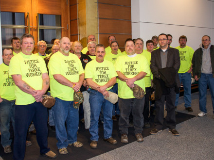 Four terminated Terex employees (front row, yellow shirts) stand with union supporters outside a federal courtroom February 17 in Minneapolis. Boilermakers' organizer Jody Mauller is fifth from left.