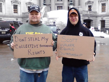 Local 107 (Milwaukee) members Jerry Maciejewski, the lodge’s vice president, and Josh Brockman take part in massive union protests at the Wisconsin state capitol.
