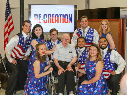 Camden Choplick, fourth from left, son of L-13 member Chester Choplick, along with other members of the group Re-Creation, meet with a veteran at Nottingham Village in Northumberland, Pa.