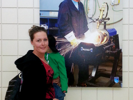 Stefanie Hamilton pauses in front of a welding photo at the Northern Alberta Institute of Technology in Edmonton.