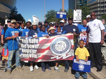 L-1814 members march near the Superdome with other unions and supporters to keep