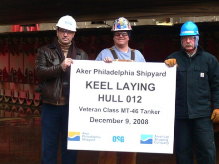 Holding a plaque for a tanker’s keel-laying ceremony are, l. to r., OSG Rep Panos Hatzikyriakosm, L-19 Sec.-Treas. Fred Chamberlain, and maintenance supervisor William Bowman. 