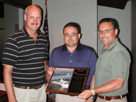AmerenUE plant manager David Strubberg (c.) presents a plaque in appreciation for a job well done to L-27 BM-ST William J. Noll (l.) and Donald Thurmond, lodge president and business rep. Photo courtesy of the St. Louis/Southern Illinois Labor Tribune
