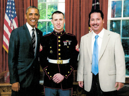 L-28 apprentice and Marine guard Justin Hynes stands with his father, Franny, and President Barack Obama. 